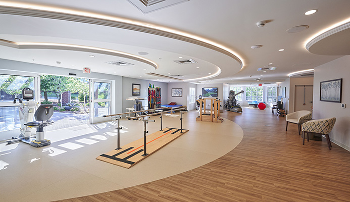 The spacious new physical therapy gym looks out to the new therapy courtyard.
